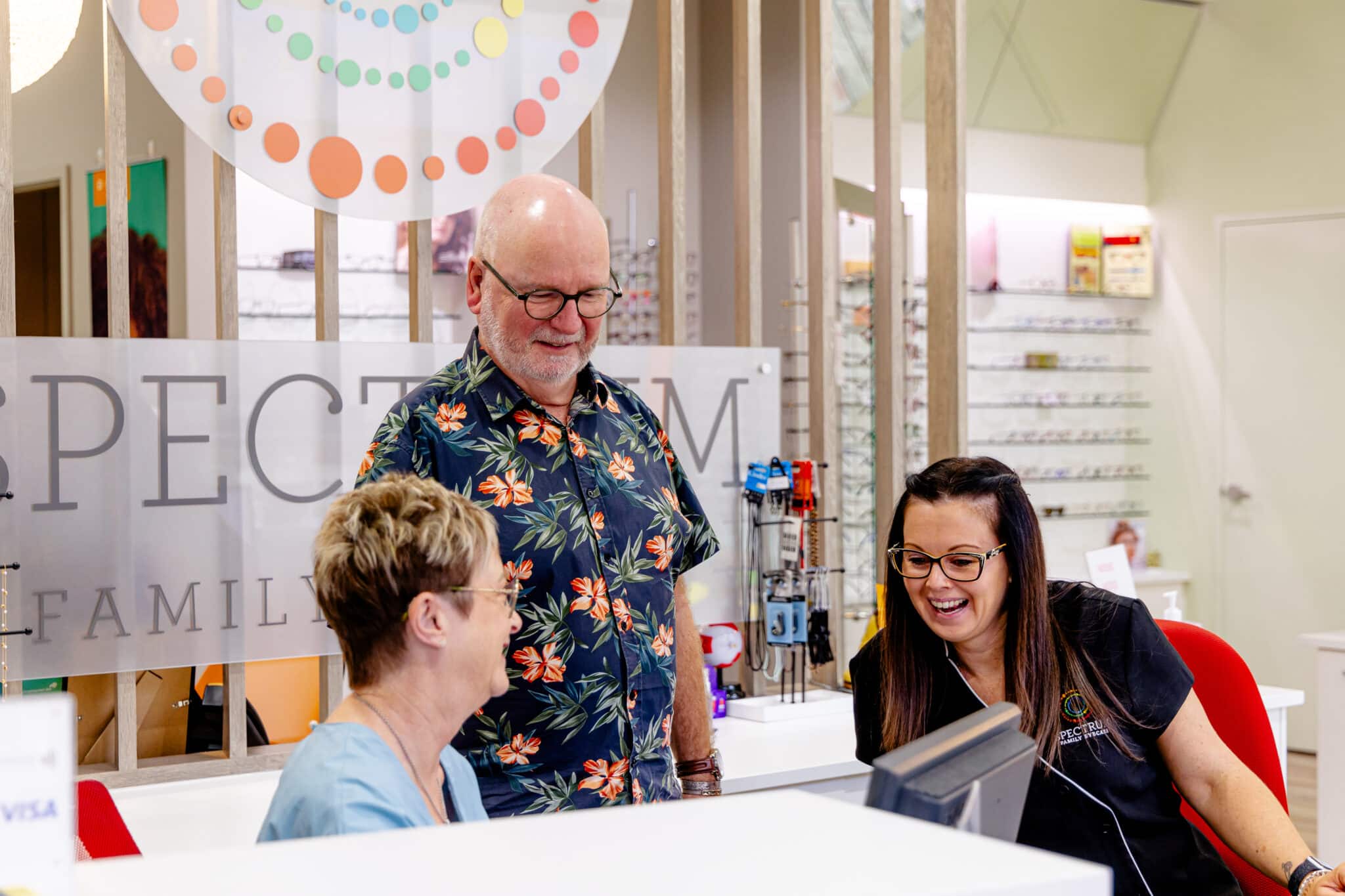 The Spectrum team greeting patients at the counter