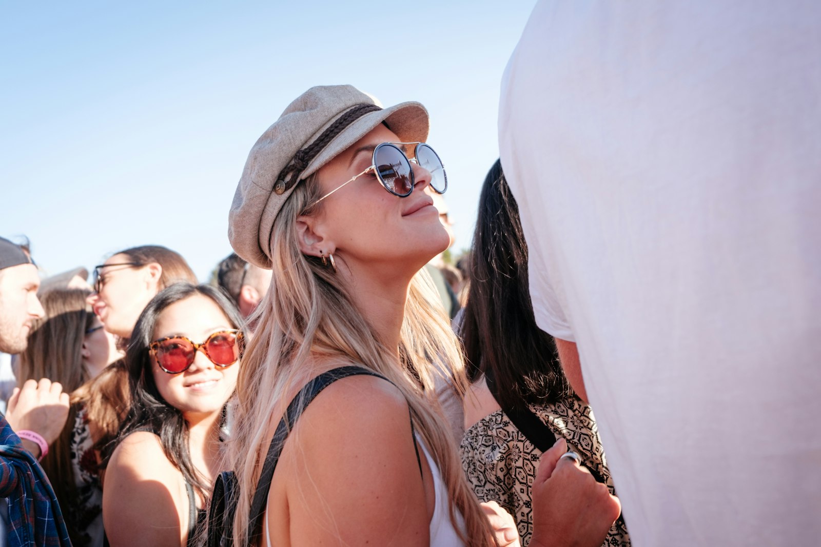 Friends outdoors in the sun wearing sunglasses