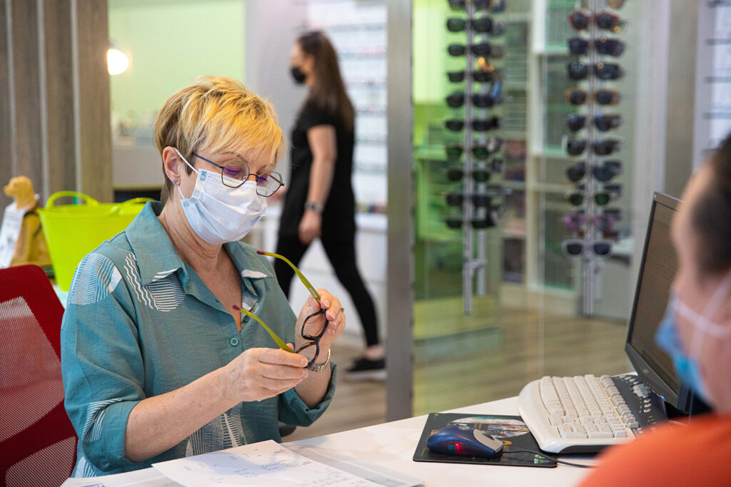 Gill, a Spectrum employee carefully inspecting a customers' used glasses